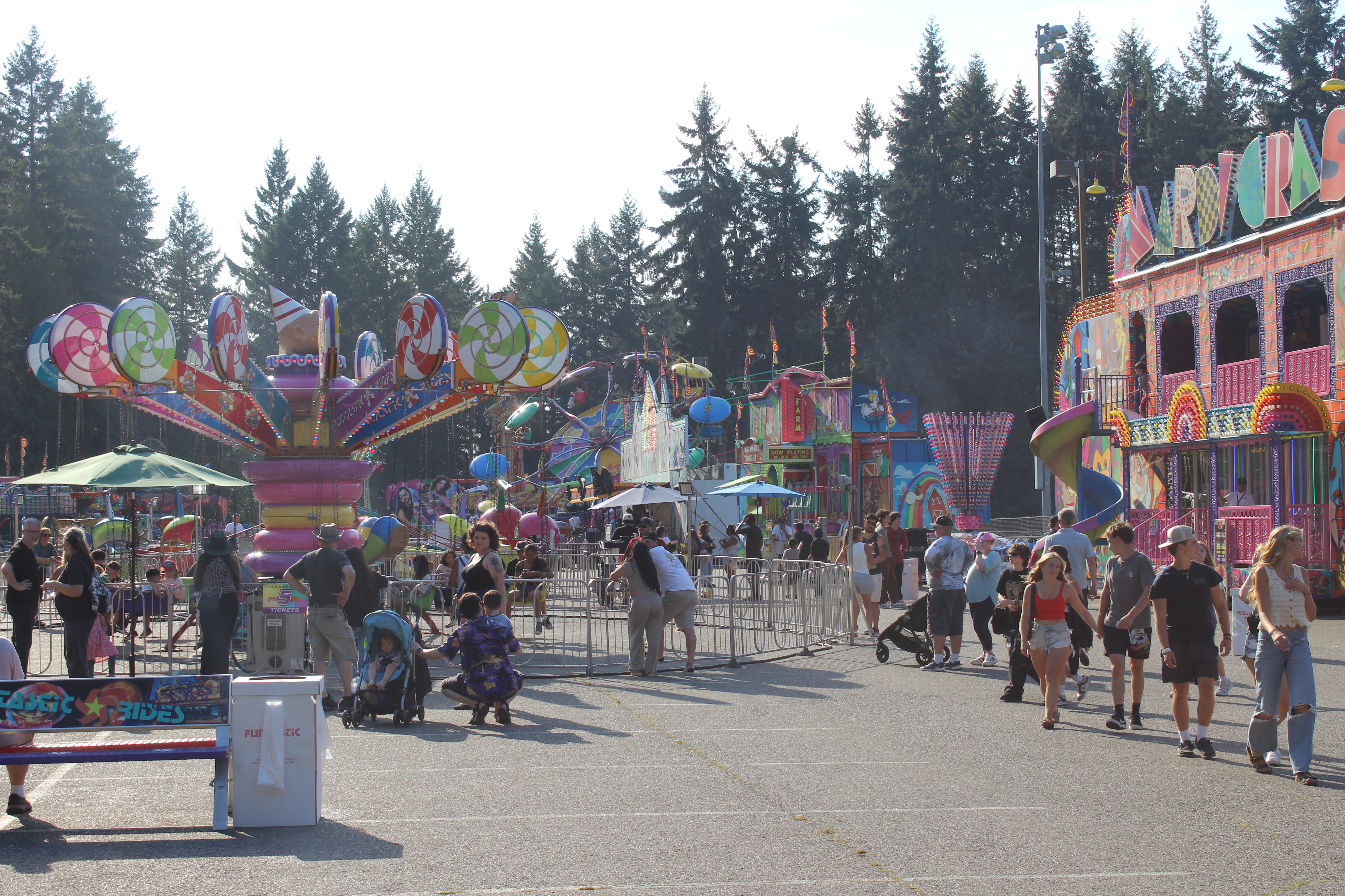 Carnival rides and crowd in a fairground